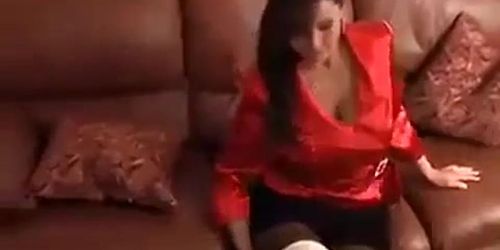Red shirt woman Christina carter on couch