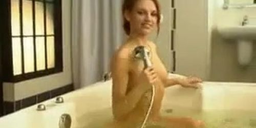 Posing naked in a bathtub