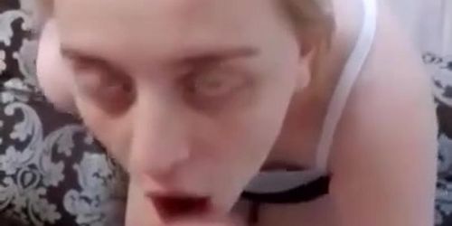 Skinny blonde pleases her bf and sits on her knees and sucks his big dick. His dick is extremely huge compared filling her mouth