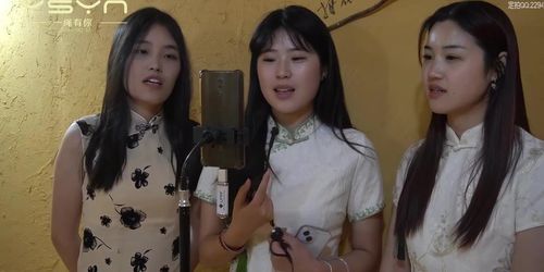 Three girls bound singing
