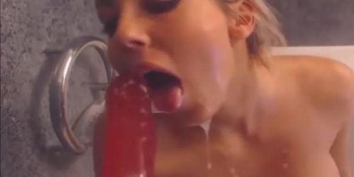 very hot blonde getting nasty with a dildo down her throat