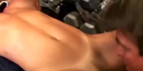 A big tit bodybuilding brunette babe gets horny in a gym so she takes on two rough cocks