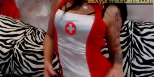 Busty Latina chick in a nurse outfit plays with her pussy