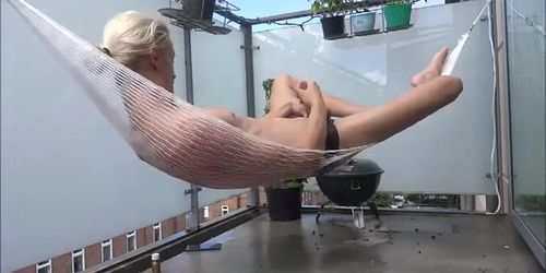 Danish twink jerks off in hammock on balcony (Denmark)