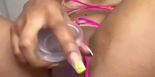 Latina in pink lingerie fucks a glass dildo