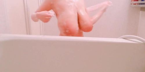 Busty woman on bathtub