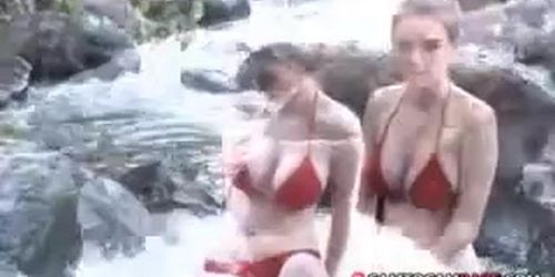 Sexy mix Asian bikini model at waterfall