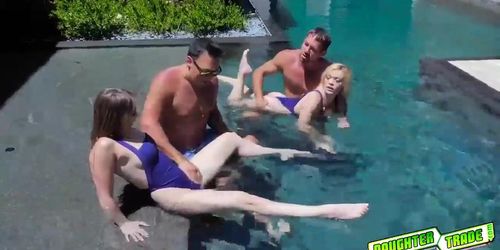 Besties Katie Kush and Kenzie Madison gets fucked by the pool by their hot daddies