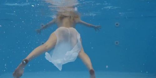 Finnish girl swims nude in the pool