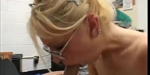 Blonde milf with glasses sucks a completely shaved guys cock