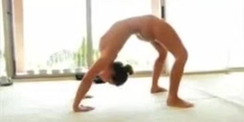 Sexy brunette doing yoga nude