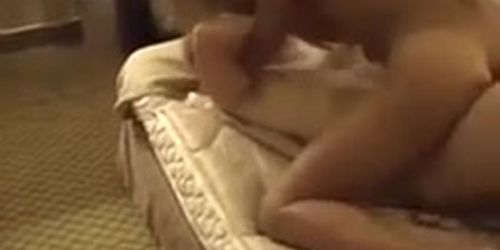 Two girls pull the sheets off the bed while making love