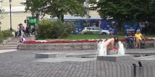 Huge boobs slave bath in fountain in downtown