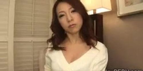 Horny Japanese MILF kneels to blow a strangers big dick