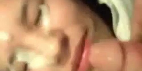 Chubby sweet Asian girl getting a massive facial in closeup