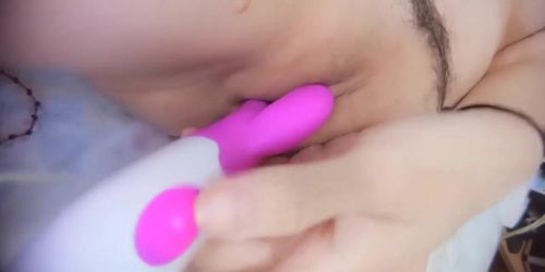 Busty Chinese girl opens up her legs and toys her pink pussy with dildo