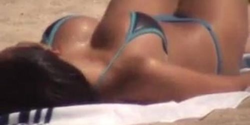 Tan busty asian in beach voyeur video