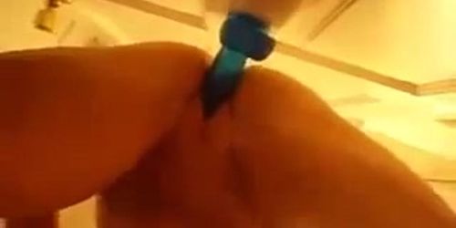 Amateur squirts with jelly dildo on door