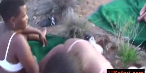 Two African chicks screw white tourist during safari in desert