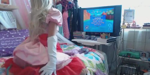 Sexy princess cosplayer playing her video game