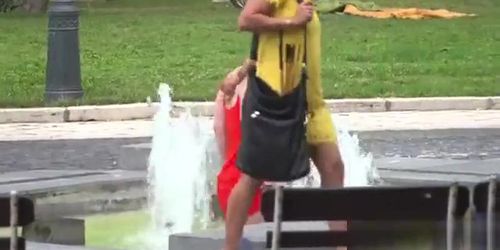 Busty girl walking naked in fountain