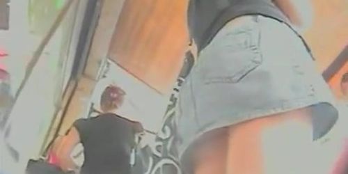 Horny upskirt video of a bare ass hottie in the street