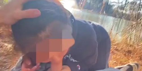 Asian sucking cock by the lake