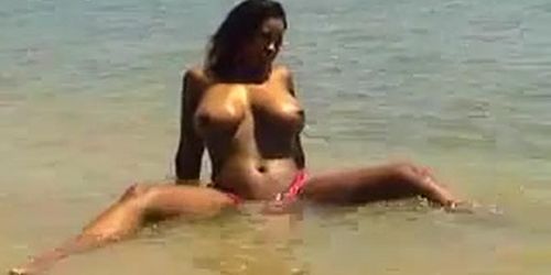 ebony girl pink bikini on beach