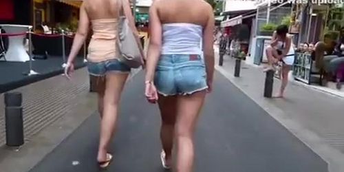 Two girls with sexy butts.