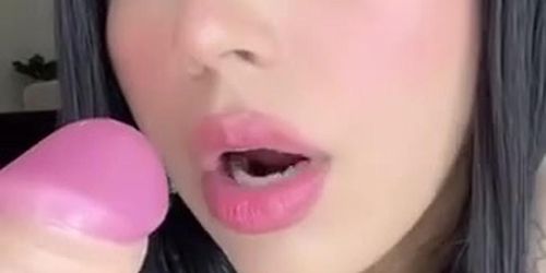 Latina sucks a dildo for a fan
