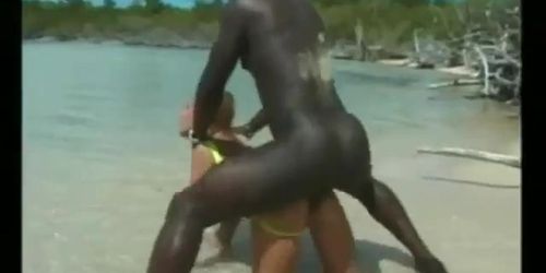 A blonde slut satisfies a black and a latino man at the beach