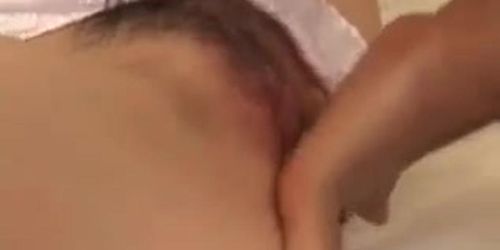 Mai pulls her panties a side and gets fingered and dildoded