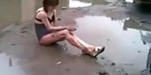 Drunk whore in the muddy puddle