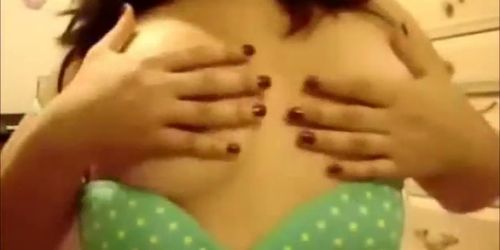 Young teen plays with breasts on live webcam