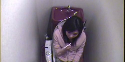 Japanese girl masturbating hard on toilet