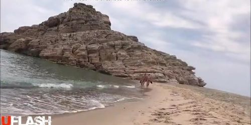 A Couple Walking Bare on the Beach