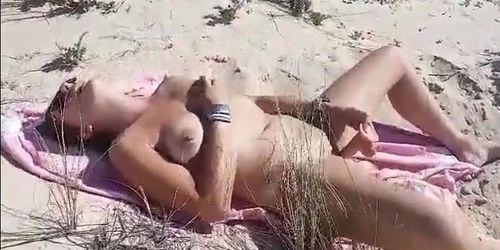 Shes wanking on the beach