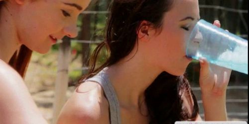 Two pretty teens lesbosex in the garden (Ava Sparxxx)