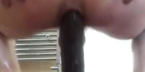 Femboy bubble butt rides big black dildo