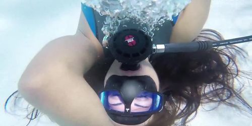 Woman masturbating in scuba gear