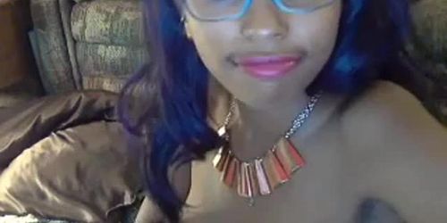 Black teen strips and fingers wet pussy on webcam