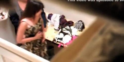 Spying mother picking clothes for daughter