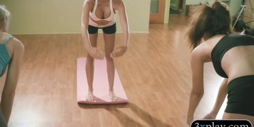 Busty yoga trainer teaching techniques