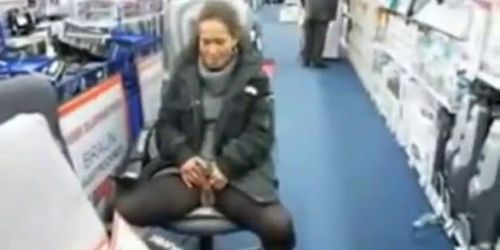 Cute milf pisses in the middle of a store