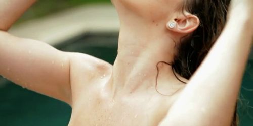 Dreamy young brunette beauty goes naked at the pool