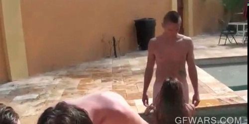 Wet chicks sucking dicks in a row by the pool