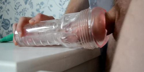 Smartly dressed man strips and fucks clear fleshlight