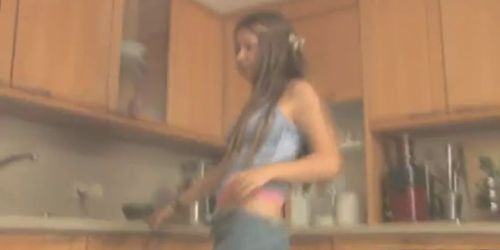 Teen striptease in the kitchen