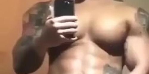 tatted up muscle man pumps a nice load of cum