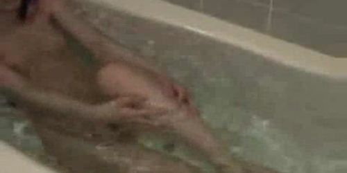 Japanese girl masturbates with fingers, toothbrush in tub